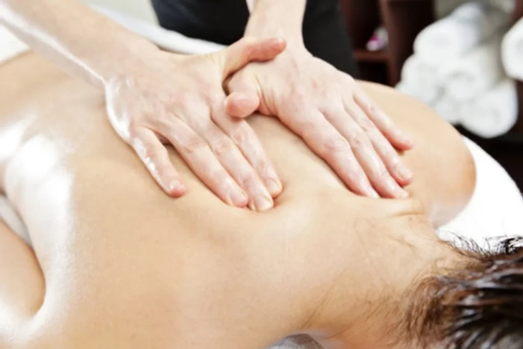 Therapist performing Best Balinese and Swedish massage in Basavanagudi on back.