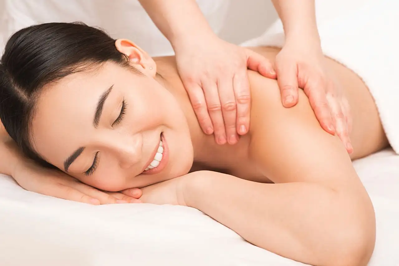 Best Body Massage Near Me in Basavanagudi – woman enjoying relaxing massage.